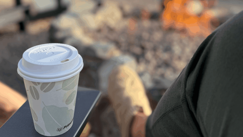 Morning coffee and quiet reflection by the fire — a gratitude practice moment.