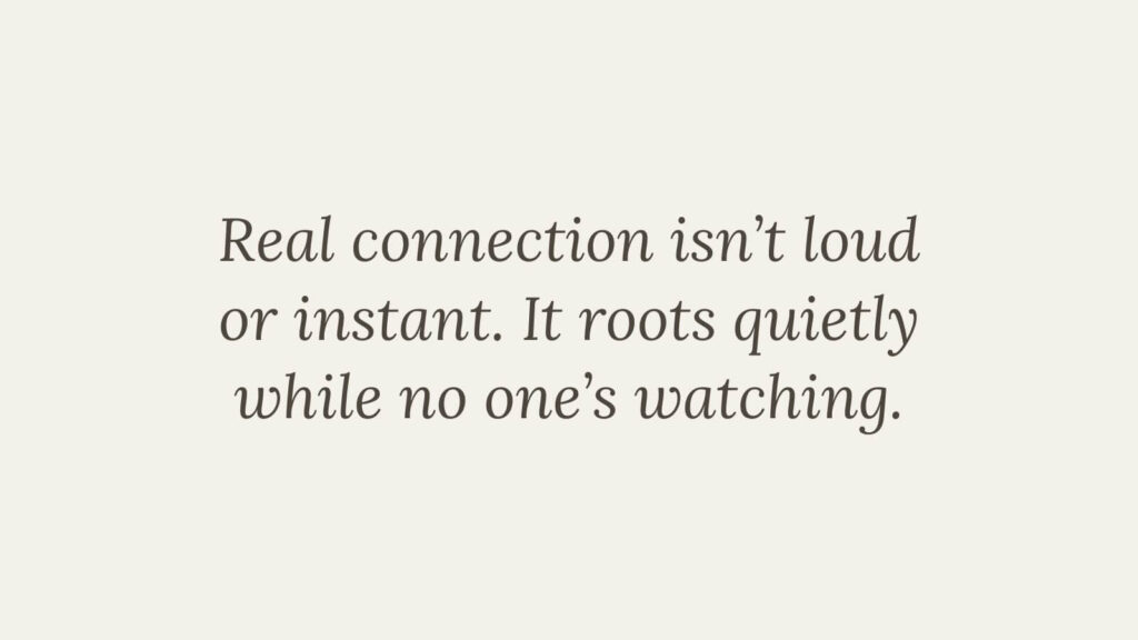 Text graphic reading “Real connection isn’t loud or instant. It roots quietly while no one’s watching.” in minimalist serif typography on a neutral background — Feed the Birds First.